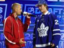 Singer Justin Bieber talks with Gavin McKenna after McKenna was drafted by the Toronto Maple Leafs with the first overall pick during day one of the 2026 NHL Draft on June 26, 2026 in Buffalo, N.Y.