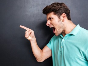 Side view of a angry young man