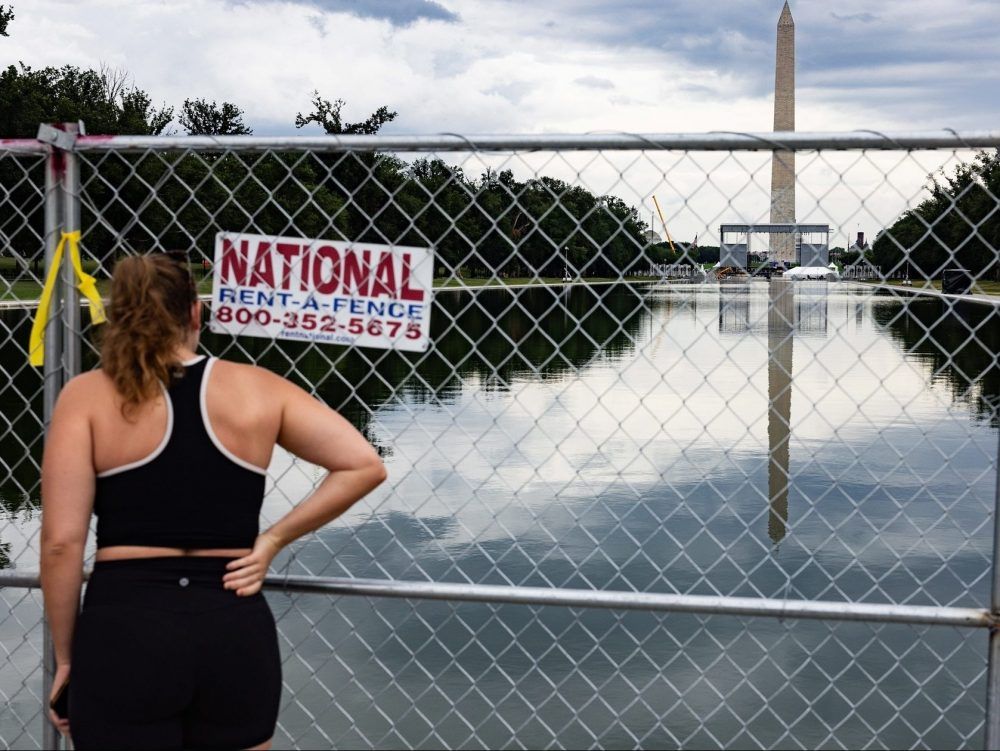 A person views the Lincoln Memorial Reflecting Pool from behind a fence on June 27, 2026 in Washington, DC. Fencing has been installed around the area after claims made by President Trump that vandalism was the cause of the damage.