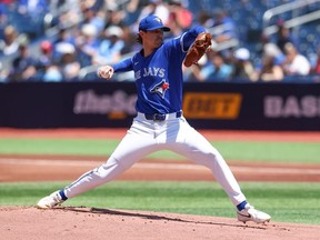 Shane Bieber of the Toronto Blue Jays pitches in the first inning of their MLB game.