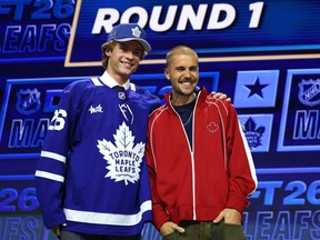 Gavin McKenna and Justin Bieber look on after McKenna was drafted by the Toronto Maple Leafs with the first overall pick during day one of the 2026 NHL Draft in Buffalo.
