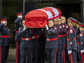 The casket holding Toronto Police Const. Marc Pinizzotto is carried at his funeral at Toronto Congress Centre on Wednesday June 24, 2026.