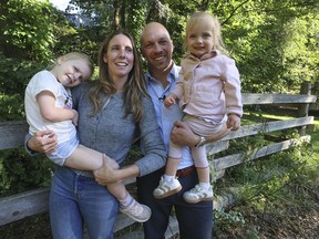 City Councillor Brad Bradford, of Beaches-East York, with his daughter Bronwyn (right) and his wife Kathryn with Briar at a kids playground.