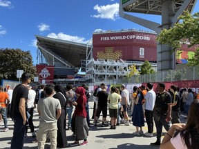 Fans wait to get into BMO Field for the Germany-Ivory Coast FIFA World Cup match in Toronto on Saturday, June 21, 2026.