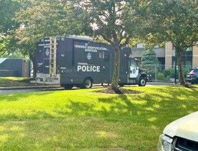 Toronto Police at the scene after an officer was shot on Martha Eaton Way on Thursday, June 11, 2026.