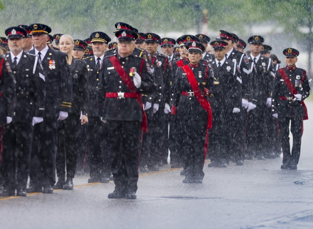  Rain falls during the police funeral procession for OPP Const. Tarun Bali at the Mississauga Sports and Entertainment Centre on Thursday, June 18, 2026. Const. Bali was killed in the line of duty on June 9.