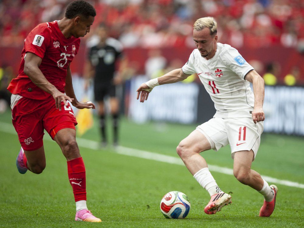 Canadas Liam Millar fights for the ball with Switzerlands Luca Jaquez during the irst half of play in the Canada versus Switzerland game during FIFA World Cup 2026 in Vancouver, BC Wednesday, June 24, 2026.