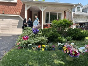 Bouquets of flowers from well-wishers are left at a home in Pickering as a memorial for Eleanor Doney on Monday June 2, 2025.