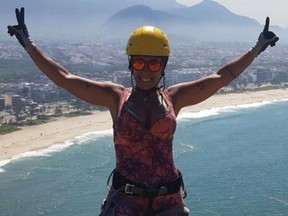 Rosemary Suzart Garcia rappelling in Brazil.