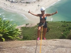 Rosemary Suzart Garcia rappelling in Brazil.