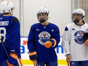 David Lewandowski (38), Caitlin Kraemer (47) and Chloe Primerano (88) take part in the Edmonton Oilers 2026 development camp.
