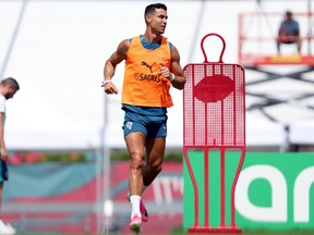 Cristiano Ronaldo of Portugal warms up during a FIFA World Cup training session.
