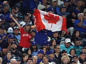 Blue Jays fans cheer during Game 3 of the ALCS in Seattle