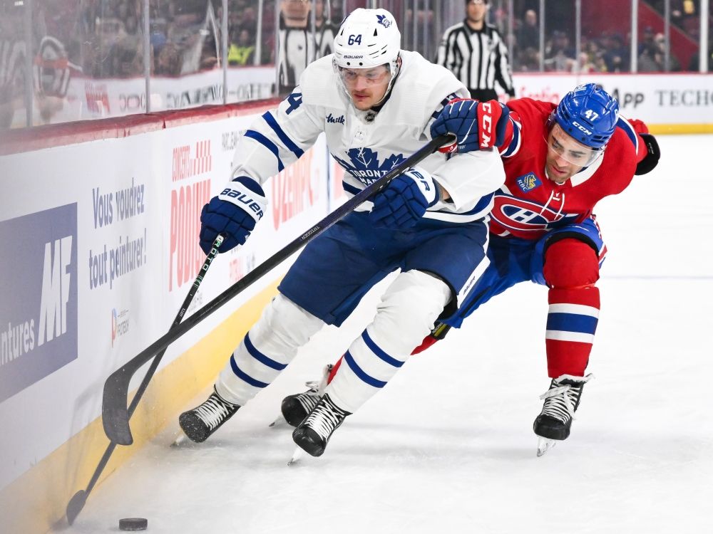 Toronto Maple Leafs' David Kampf and Jayden Struble of the Montreal Canadiens skate after the puck during a game in 2024.