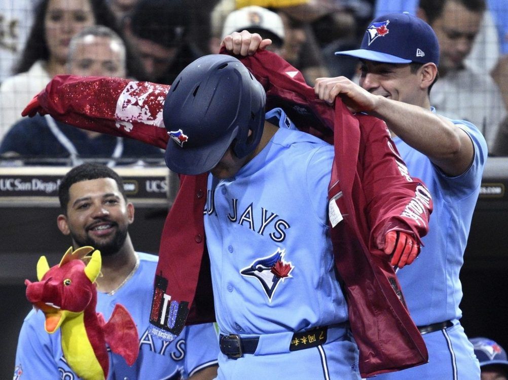 Kazuma Okamoto of the Toronto Blue Jays has the home run jacket placed on him by Brandon Valenzuela after hitting a three-run home run against the San Diego Padres during the fifth inning at Petco Park on July 10, 2026 in San Diego.




Orlando Ramirez/Getty Images)