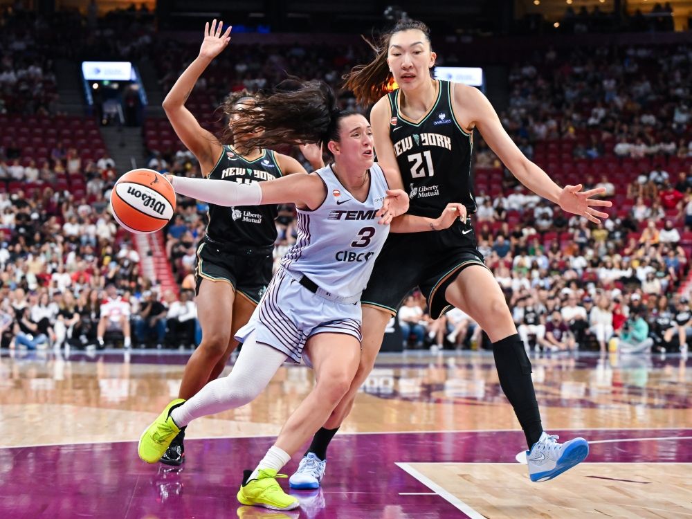 Marina Mabrey of the Toronto Tempo drives to the basket against Han Xu of the New York Liberty during their game in Montreal on Sunday.