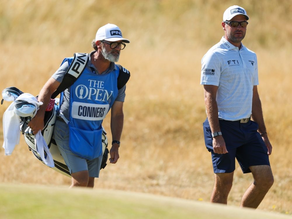 Corey Conners walks with his caddie on the fourth hole during a practice round, prior to The 154th Open Championship at Royal Birkdale.