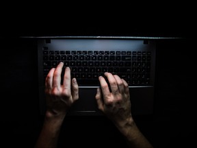 Hands using a keyboard.