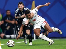 Jude Bellingham of England and Lionel Messi of Argentina compete for the ball during the FIFA World Cup 2026 semifinal.