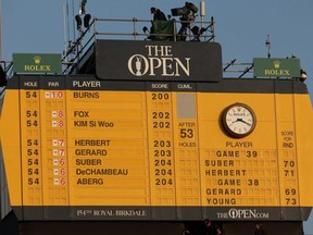 The scoreboard above the 18th green show the lead of US golfer Sam Burns at the end of play on day three of the 154th Open Golf championship at Royal Birkdale Golf Club near Southport in northwest England on July 18, 2026.