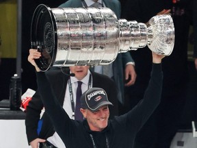 Tom Dundon hoists the Stanley Cup
