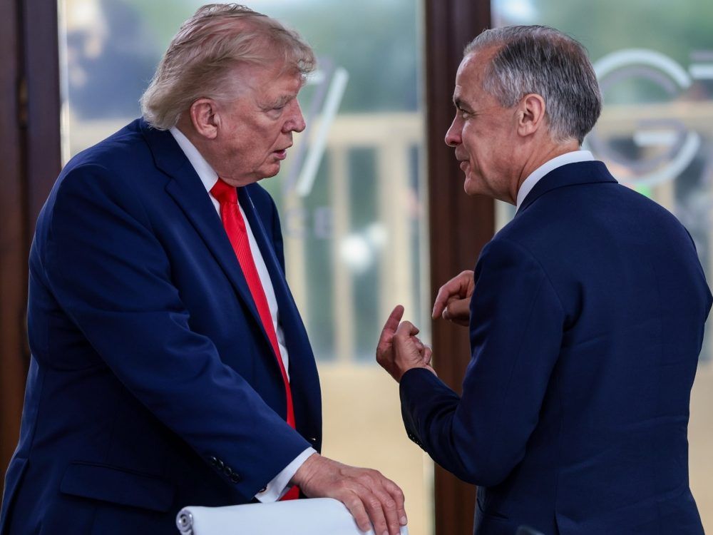 U.S. President Donald Trump speaks with Canadian Prime Minister Mark Carney at a working lunch with leaders of G7 and the Middle East, on June 16, 2026 in Evian-les-Bains, France.