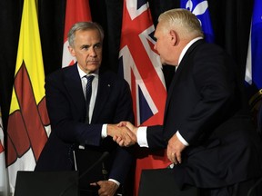 Mark Carney shakes hands with Doug Ford