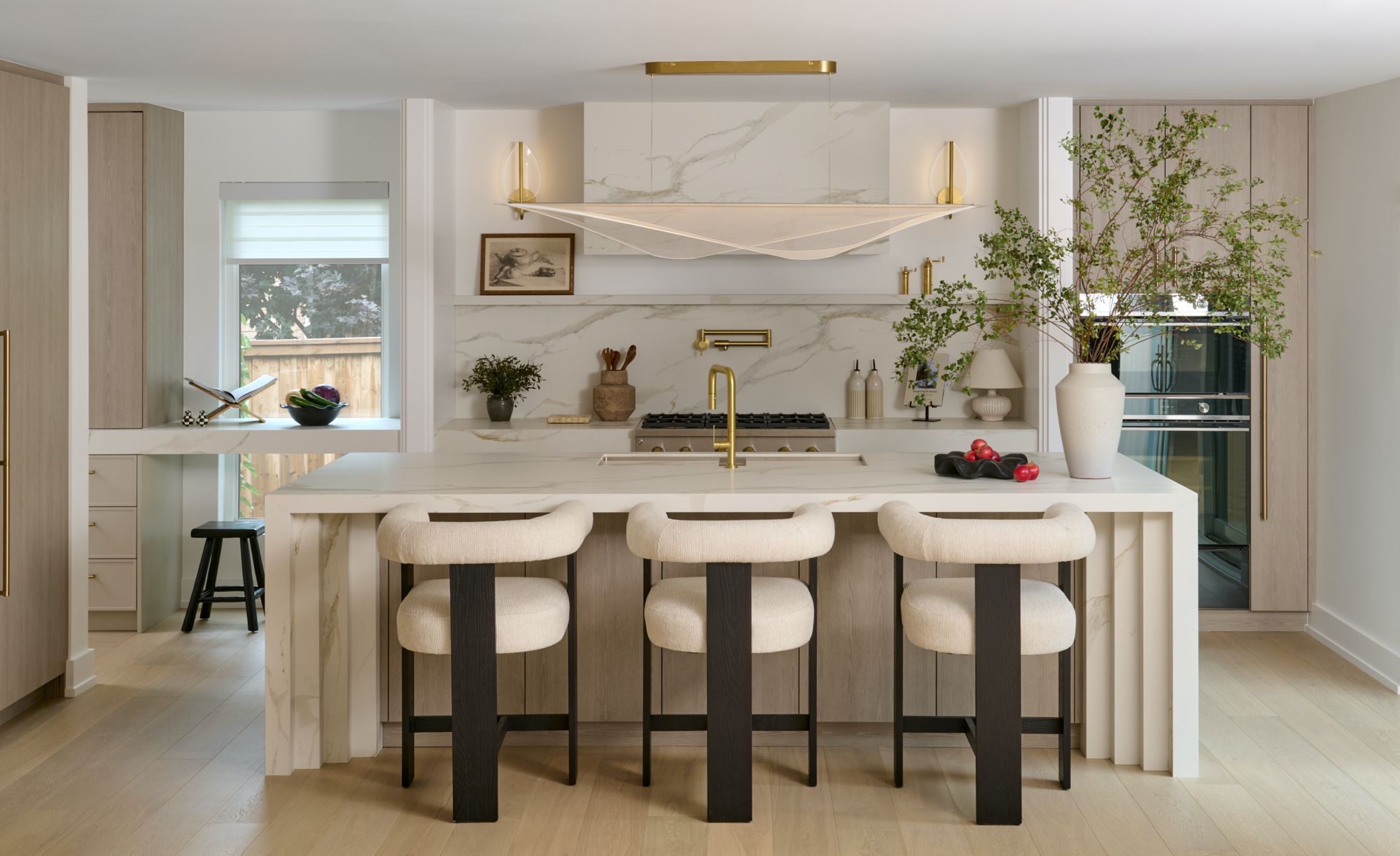 Designed for entertaining, the open-concept layout keeps guests connected from kitchen to backyard.   STEPHANIE BUCHMAN PHOTOGRAPHY