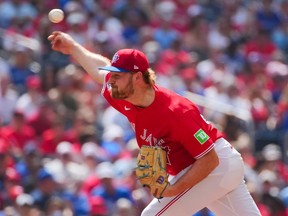 Spencer Miles of the Toronto Blue Jays pitches.