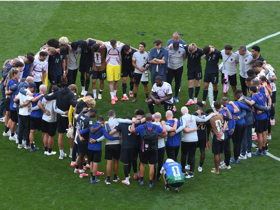 United States players and team officials huddle after the team's 1-4 loss during the FIFA World Cup 2026 Round of 16 match between USA and Belgium at Seattle Stadium on July 06, 2026 in Seattle, Washington.