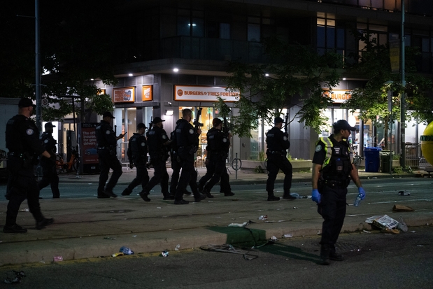 Police officers and other law enforcement personnel are seen at the intersection of St. Clair West and Arlington Ave., near the site of a shooting that occurred at the Salsa on St. Clair Festival in Toronto on July 11, 2026. Police officers and other law enforcement personnel are seen at the intersection of St. Clair West and Arlington Ave., near the site of a shooting that occurred at the Salsa on St. Clair Festival in Toronto on July 11, 2026.
