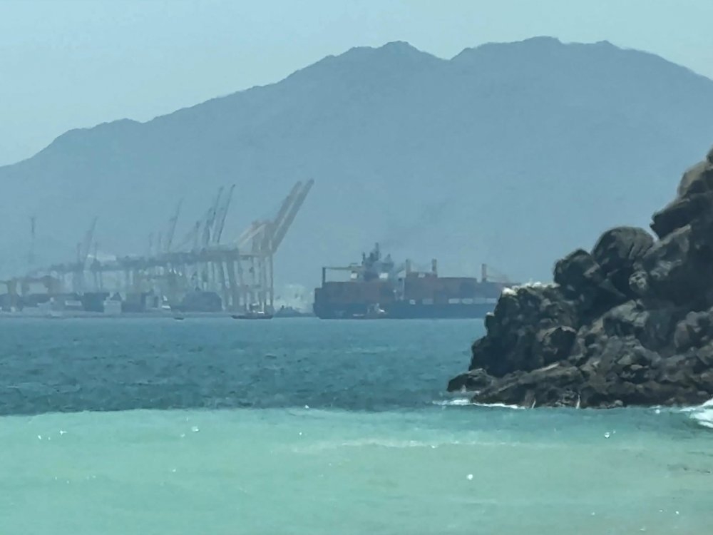  This frame grab taken from AFPTV video footage on July 12, 2026 shows a ship sailing near the Strait of Hormuz off the eastern coast of the United Arab Emirates at Khor Fakkan.