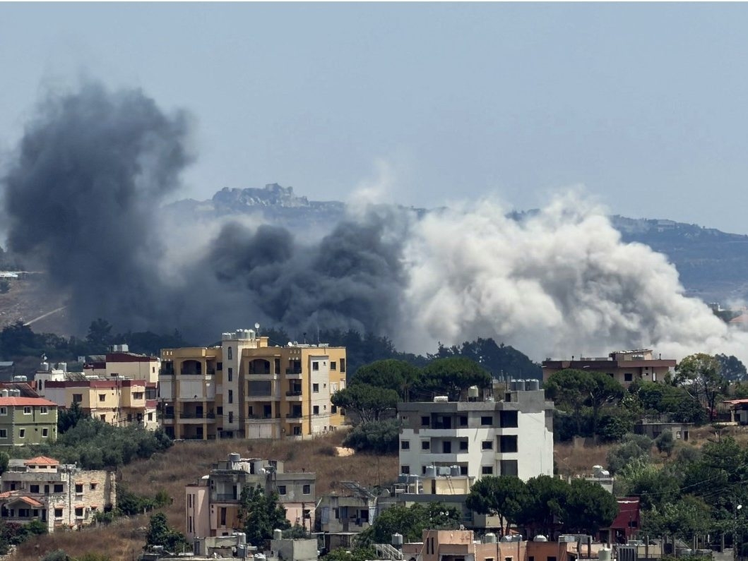 This photograph taken from the southern city of Nabatieh shows smoke rising from the site of an Israeli airstrike that targeted the nearby village of Nabatieh al-Faouqa on July 16, 2026. = This photograph taken from the southern city of Nabatieh shows smoke rising from the site of an Israeli airstrike that targeted the nearby village of Nabatieh al-Faouqa on July 16, 2026. =