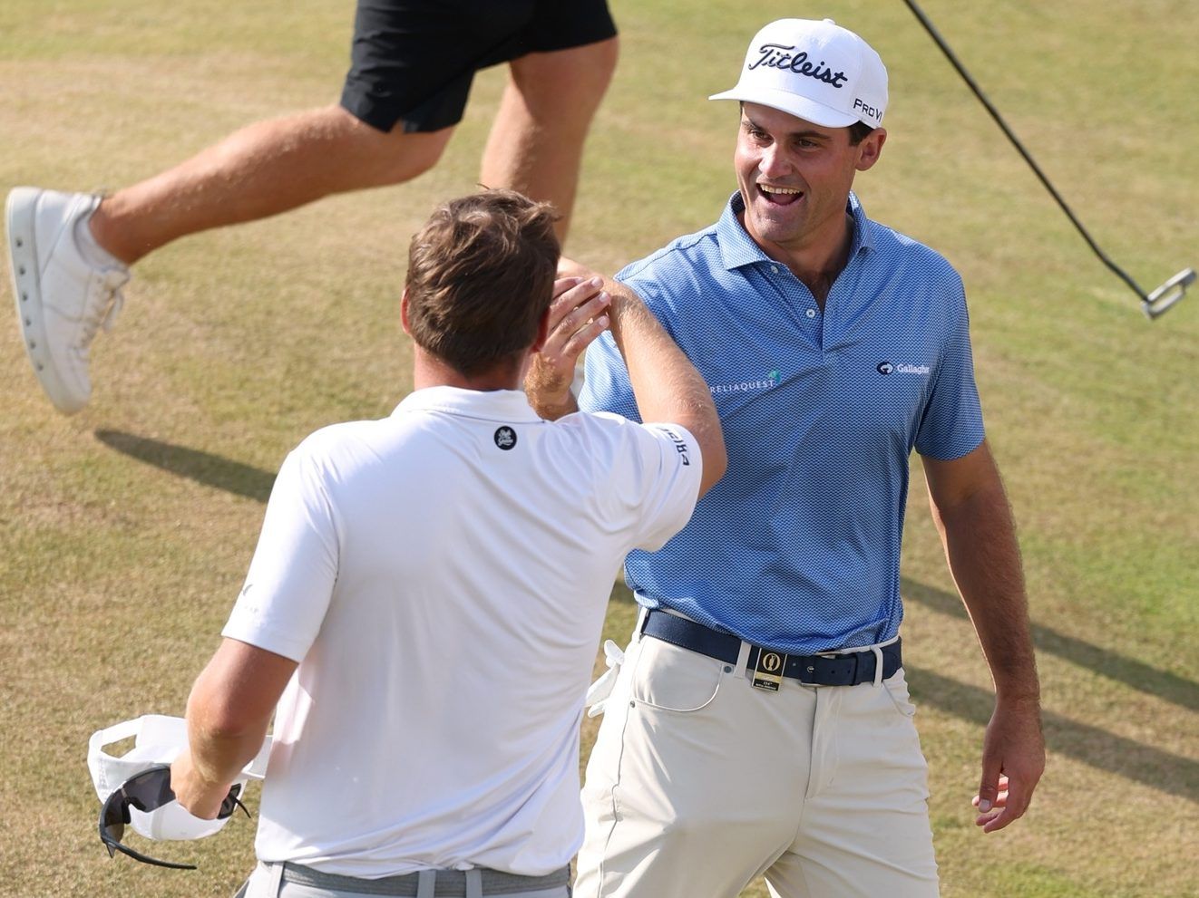 Jackson Suber of the United States and Sami Valimaki of Finland shake hands.