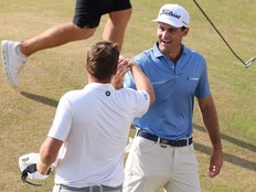Jackson Suber of the United States and Sami Valimaki of Finland shake hands.