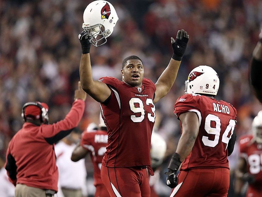 Defensive end Calais Campbell #93 of the Arizona Cardinals celebrates after a defensive stop during the NFL game against the Cleveland Browns at the University of Phoenix Stadium on December 18, 2011 in Glendale, Arizona.