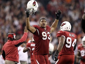 Defensive end Calais Campbell #93 of the Arizona Cardinals celebrates after a defensive stop during the NFL game against the Cleveland Browns at the University of Phoenix Stadium on December 18, 2011 in Glendale, Arizona.