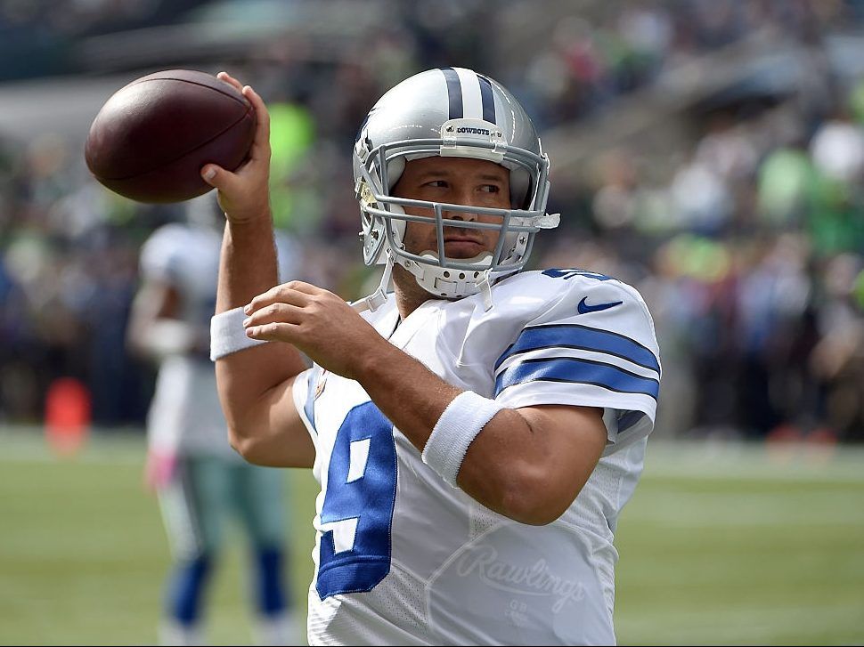 Quarterback Tony Romo #9 of the Dallas Cowboys warms up before the game aagainst the Seattle Seahawks at CenturyLink Field on October 12, 2014 in Seattle, Washington. (Steve Dykes/Getty Images)