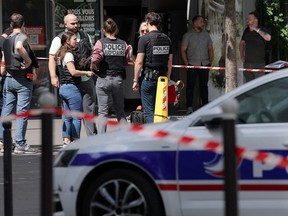 Judicial police work in a cordoned off area after a knife-wielding man wounded three people in Paris on July 27, 2026. A man suspected of injuring three people in Paris using "two knives" was "quickly" arrested, the Paris Police Prefecture. "Three identified victims were treated by emergency responders and transported to the hospital" the same source said.