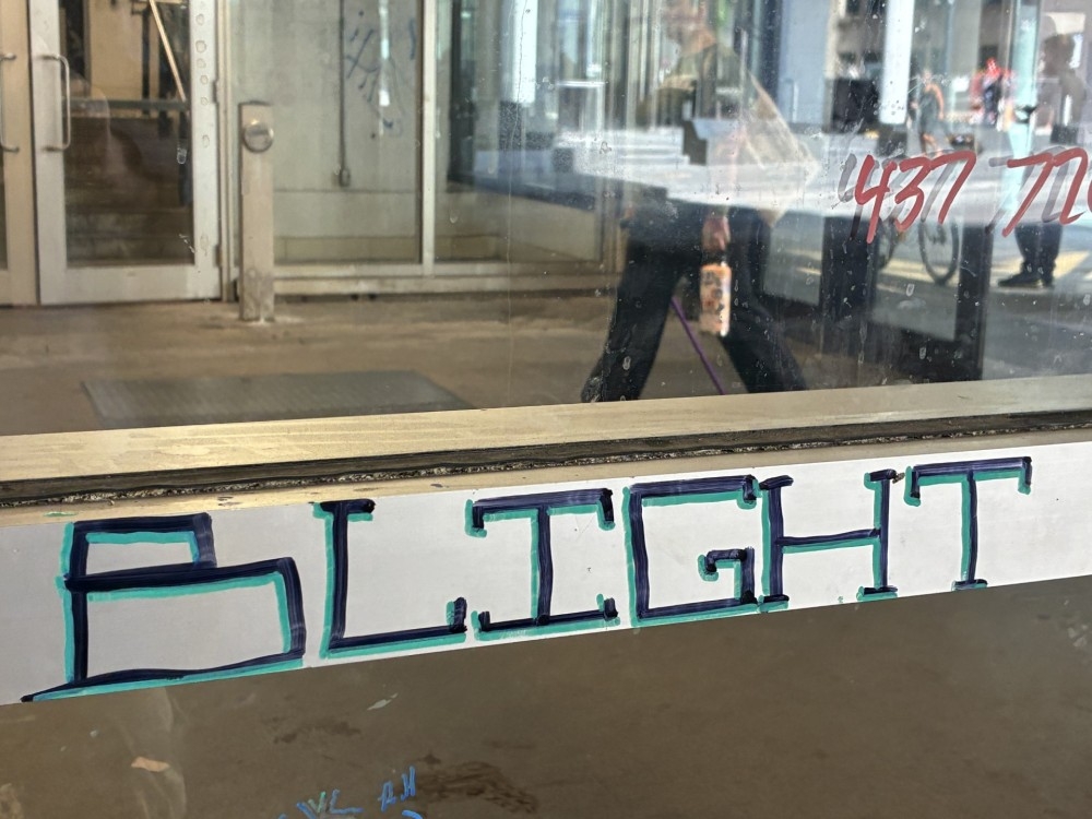  The word ‘blight’ is written on a wall near Union Station in downtown Toronto and photographed Friday, July 10, 2026.