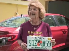 Nancy Dello Stritto, 76, holding up her wild new license plate.