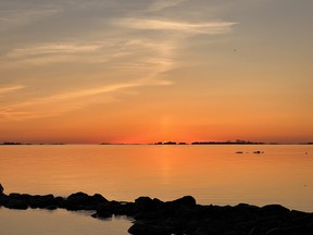 Sun setting over Lake Huron near Red Bay Beach.