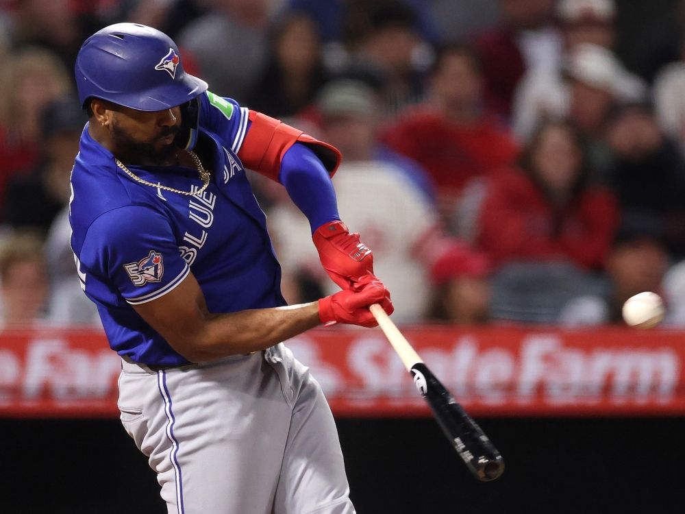 Eloy Jiménez of the Toronto Blue Jays hits an RBI flyout against the Los Angeles Angels during a game earlier this season.