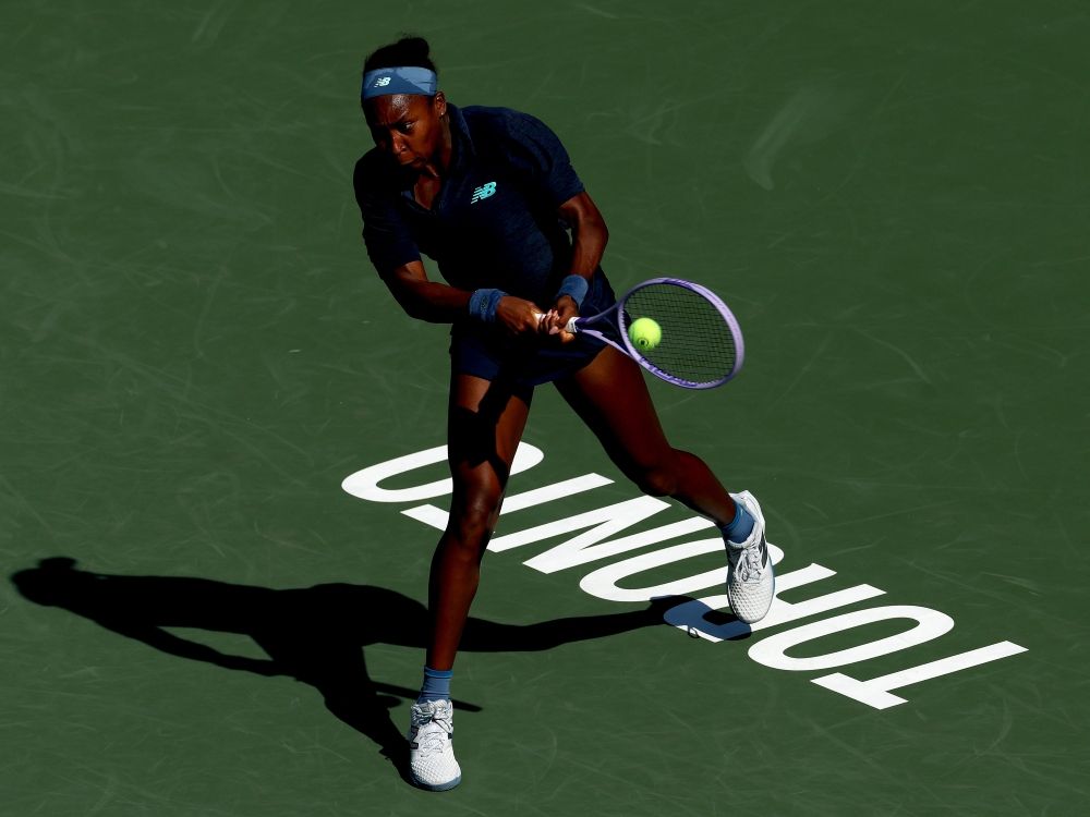 Coco Gauff returns a shot to Kayla Day during the National Bank Open in Toronto.