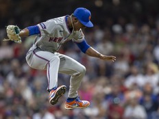 Jefry Yan of the New York Mets celebrates a strikeout during his Major League debut against the Cleveland Guardians.