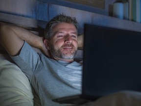 Man watching porn on his laptop