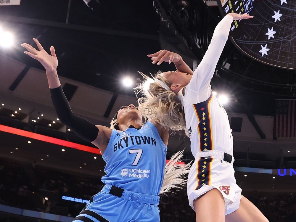 Sophie Cunningham of the Indiana Fever is fouled by DiJonai Carrington of the Chicago Sky during a WNBA game last week.