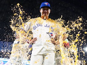 Brett Bateman of the Toronto Blue Jays is drenched in sports drink during their post-game interview following a win against the Boston Red Sox.