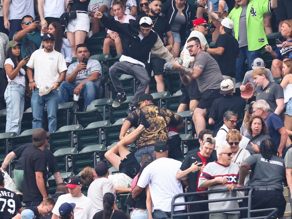 A fight breaks out on the top level at Rate Field during a game between the Chicago White Sox and New York Mets.