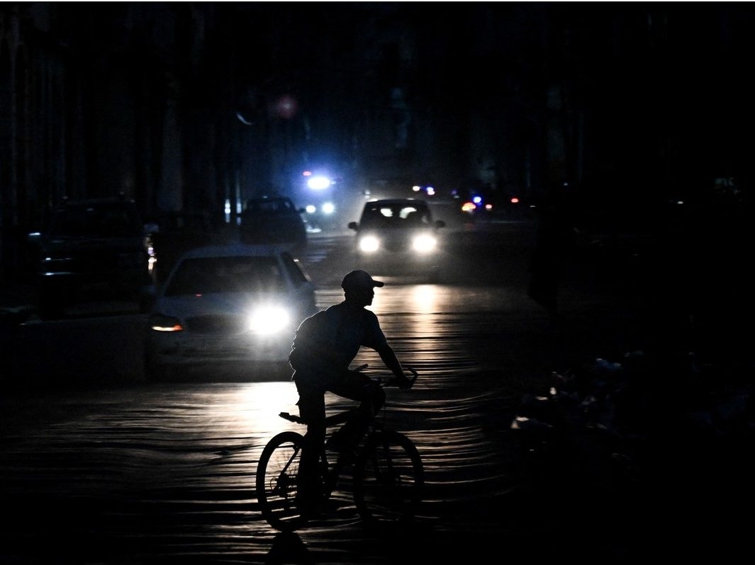 A man rides his bicycle down a street during a blackout in Havana on August 1, 2026. A man rides his bicycle down a street during a blackout in Havana on August 1, 2026.
